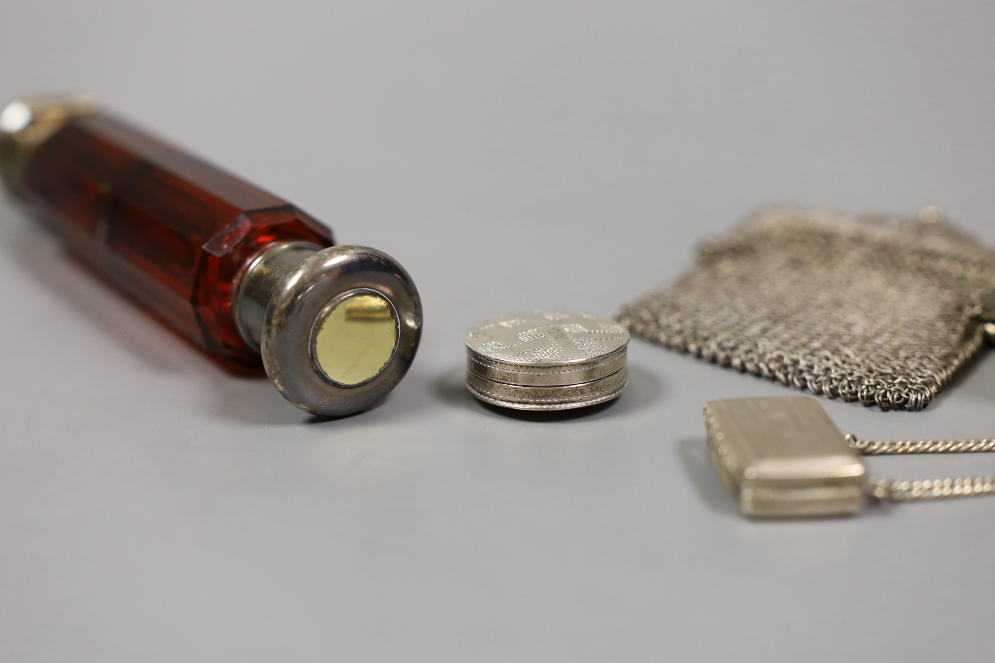 A George III engraved silver circular pill box and cover, Samuel Pemberton, Birmingham, 1803, 27mm, a George IV silver vinaigrette, Birmingham, 1825, a late Victorian small silver box and cover, a sterling porringer and